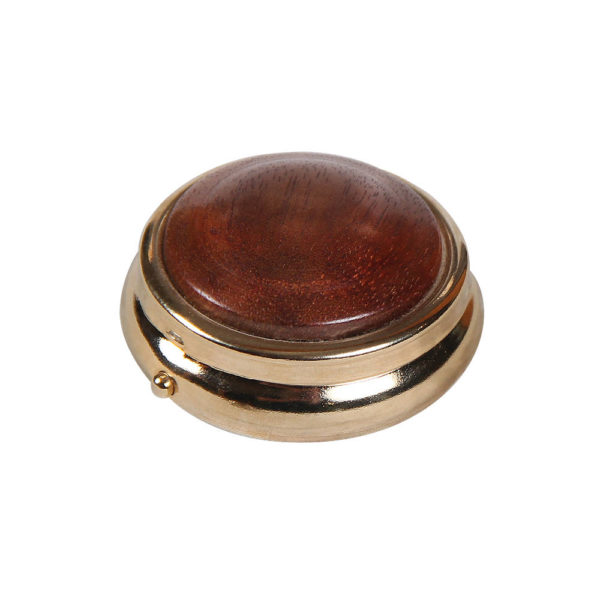 Small round wooden pill box with gold rim.
