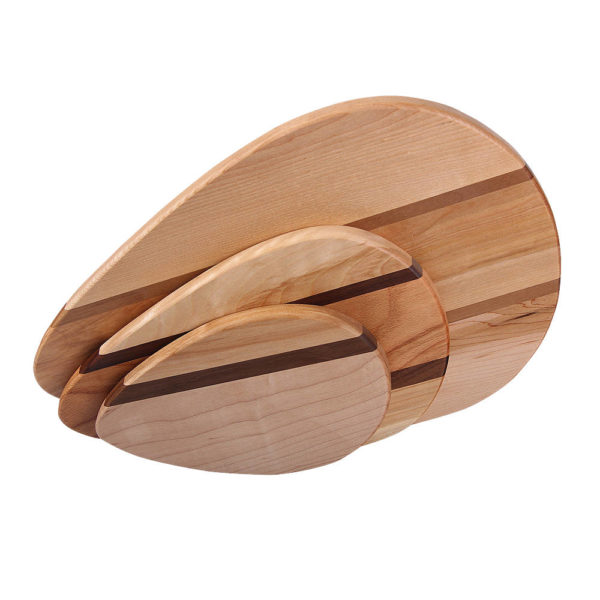 Family of accent raindrop cutting boards, small, medium, large, in various woods.